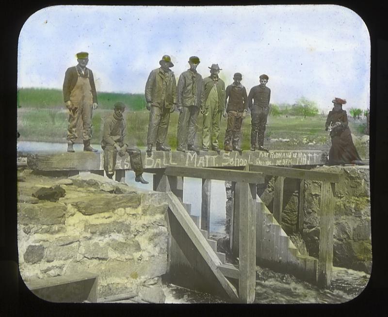 Men sit at the herring weir. Seth Mendell said herring didn't swim up the Mattapoisett River until men built forged a way between the river and Snipatuit Pond. Back then everyone was guaranteed a bushel of herring. COURTESY MATTAPOISETT HISTORICAL SOCIETY